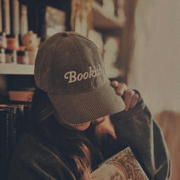 Picture of Donna holding a stack of 7 books